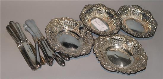 Two pairs of late Victorian pierced silver bonbon dishes and two sets of six cake knives.
